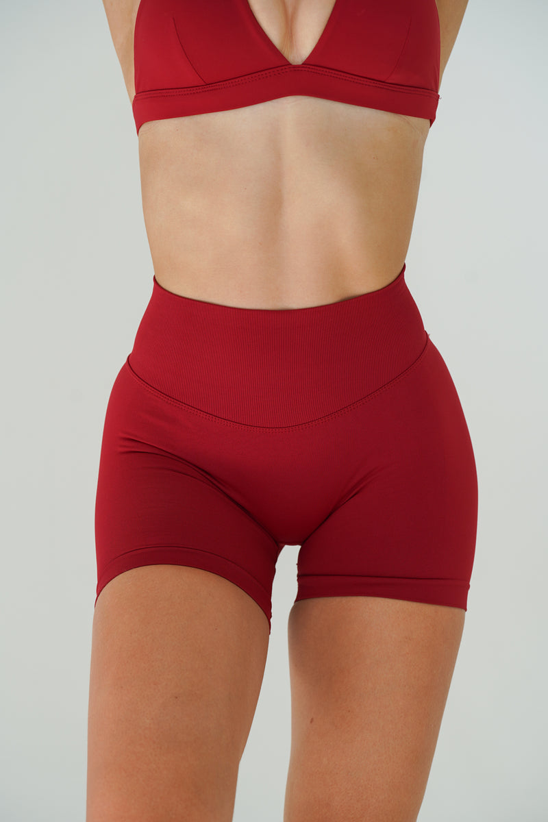 RECOIL HIGH WAIST SCRUNCH SHORTS - DARK RED
